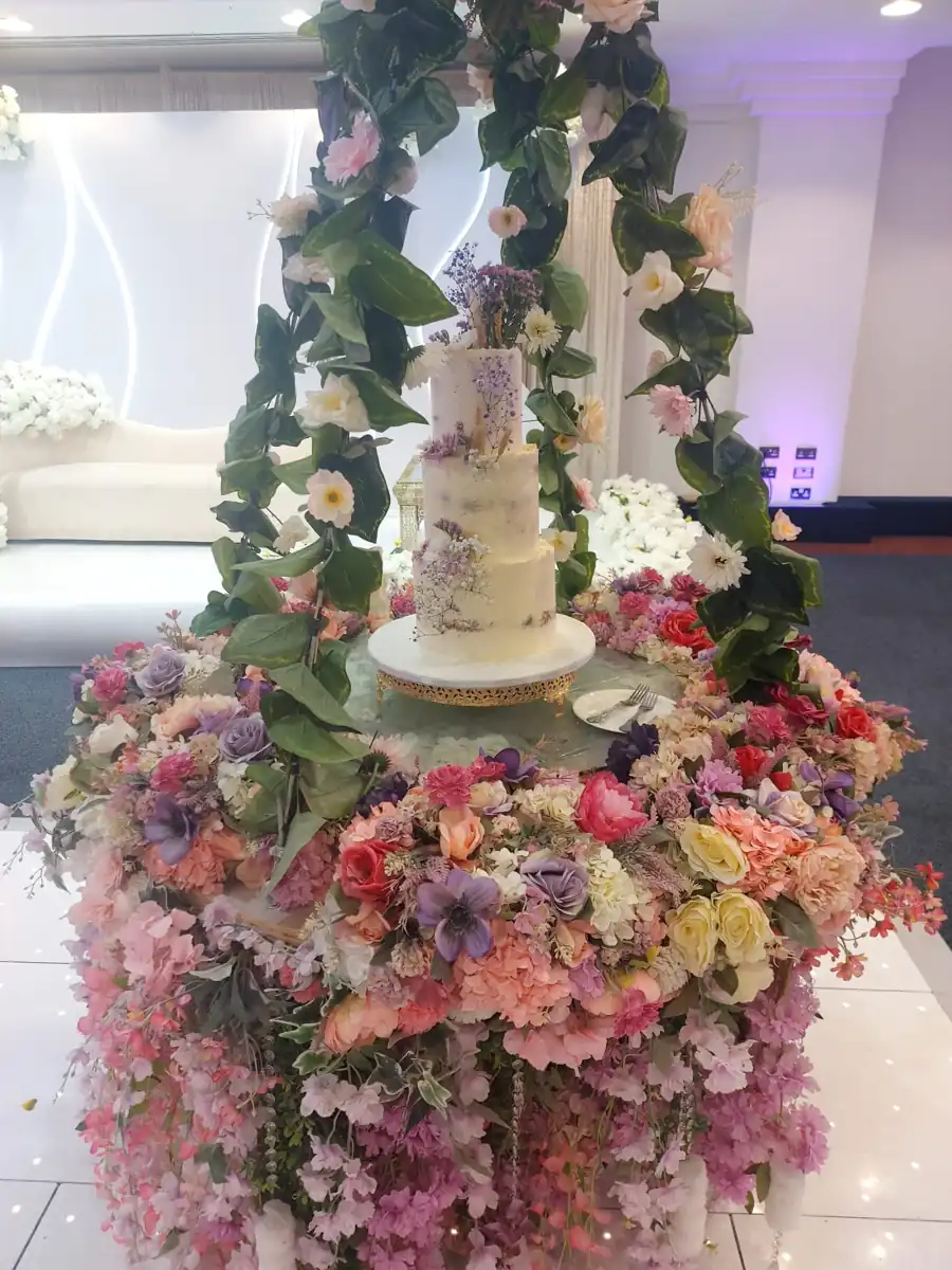 Wedding cake surrounded by flowers