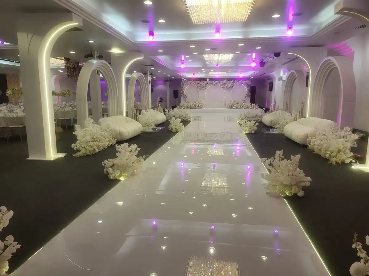 Cavendish hall dressed with flowers and illuminated arches