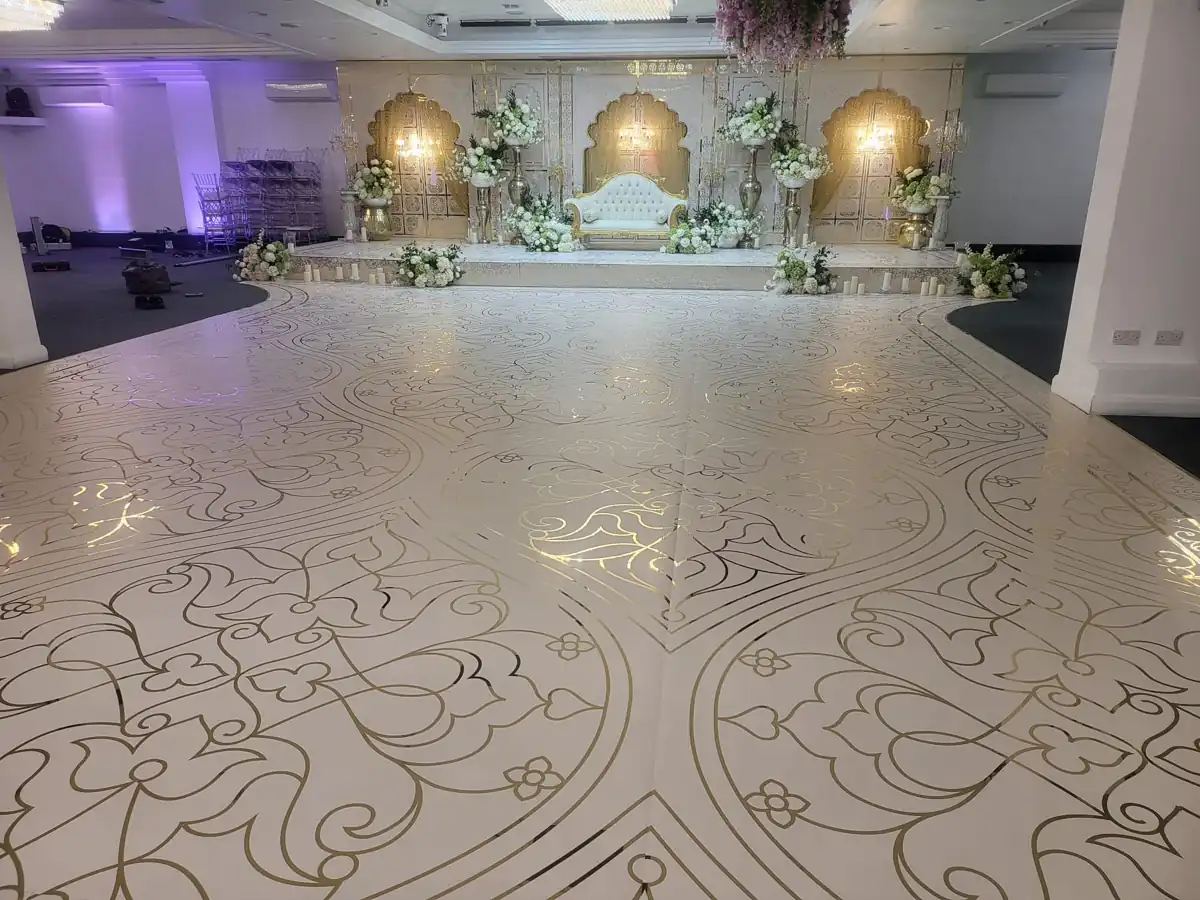 Dance floor facing the gold and white stage